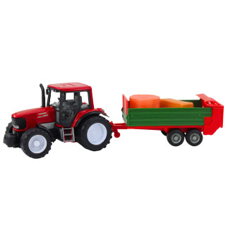 Traktor rolniczy farmerski z zieloną przyczepą i sianem czerwony