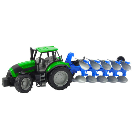 Traktor rolniczy farmerski z pługiem napęd zielony
